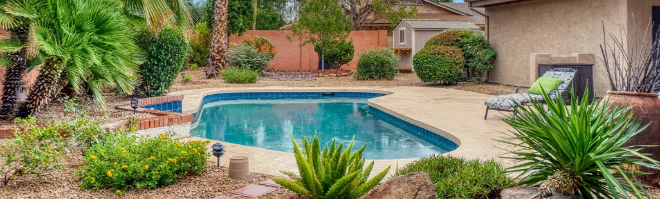 Backyard swimming pool and landscaped patio—enjoy outdoor space without mosquitoes