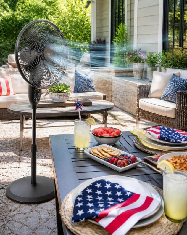 Oscillating fan creating a breeze over a 4th of July patio dining table